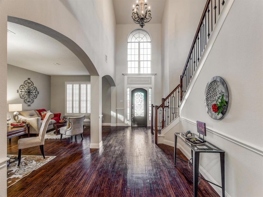 beautiful wrought iron front door and stairs