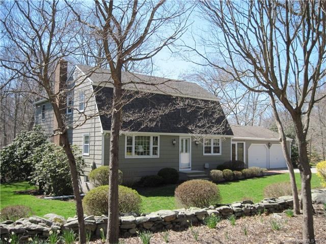 Picturesque wood shingled Dutch Colonial convenien