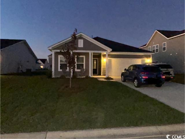 View of front of property featuring a front lawn a