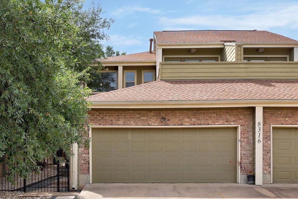 View of front of property featuring brick siding 