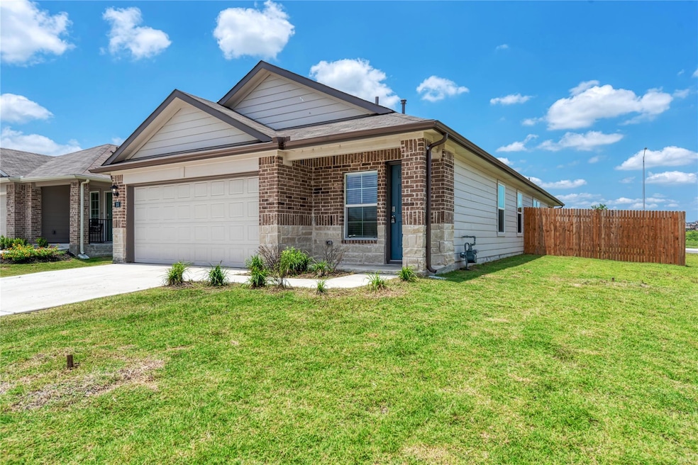Ranch-style home with an attached garage, drivewa