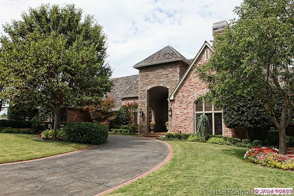 Gorgeous curb appeal with a circle drive & a stack