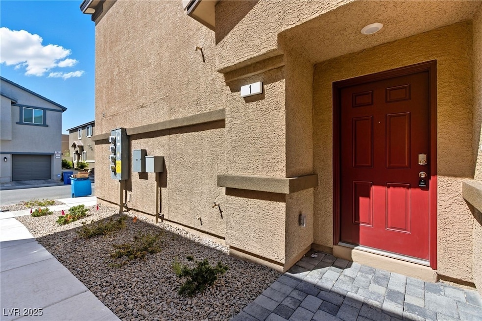 View of exterior entry featuring stucco siding