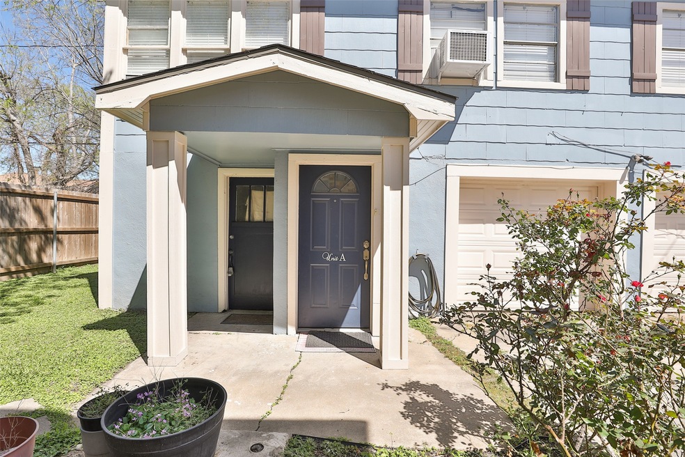 Charming entrance with a covered porch and blue do