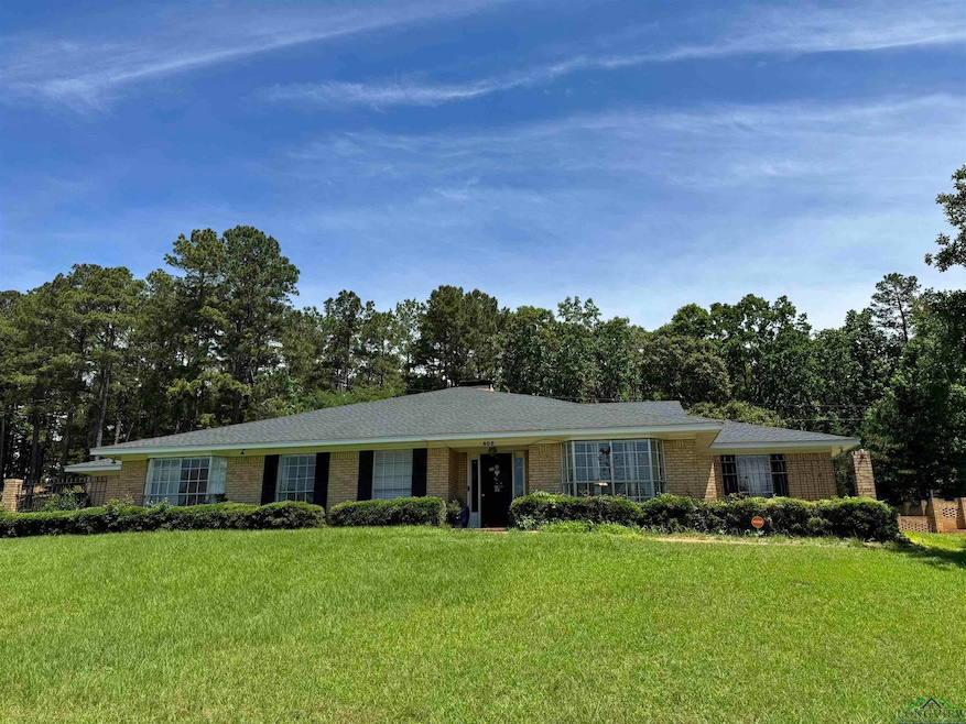 Ranch-style home with brick siding and a front lawn