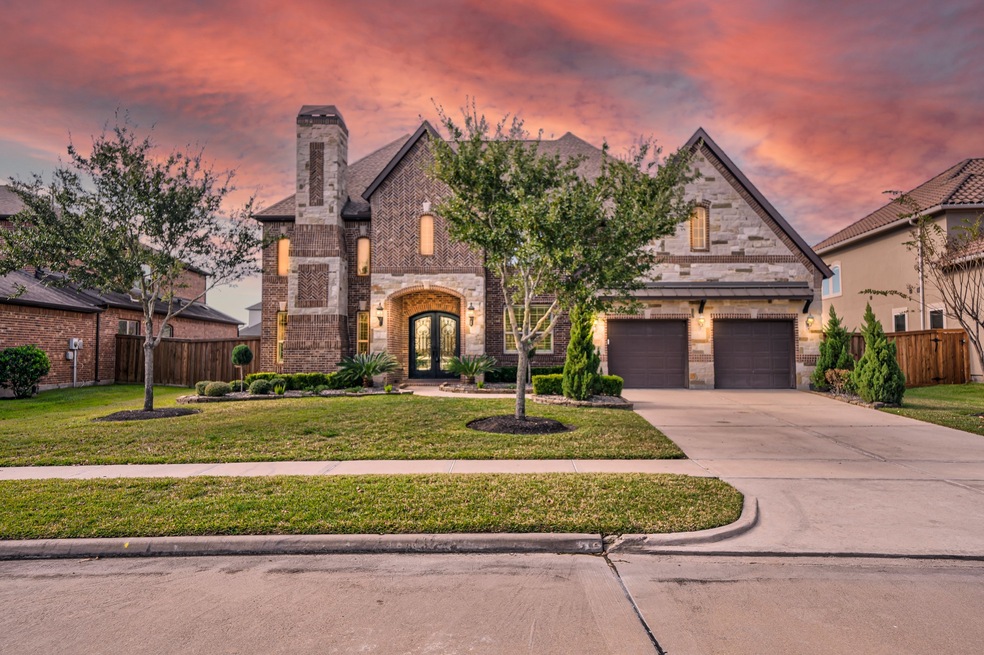 Welcome home to 2110 Granite Brook Lane located in The Reserve at Katy and zoned to Katy ISD. This stunning home has lovely curb appeal, a well-manicured lawn, beautiful landscaping, stone/brick elevation, dark stained double front door with glass detailing, covered front entryway, beautiful outdoor lanterns, and a double wide driveway.
