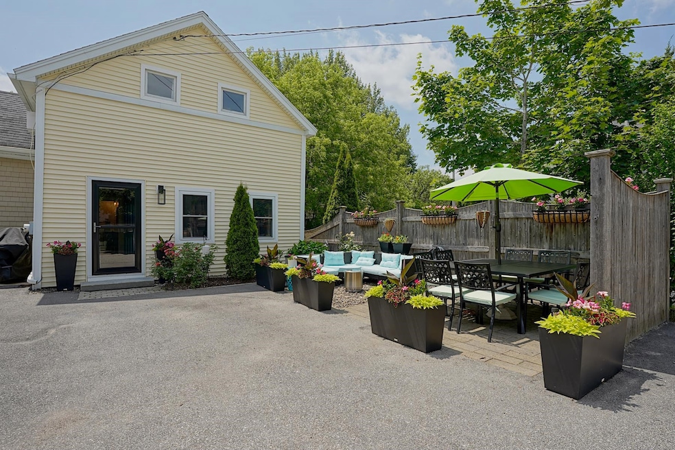Front of townhouse with outdoor seating area