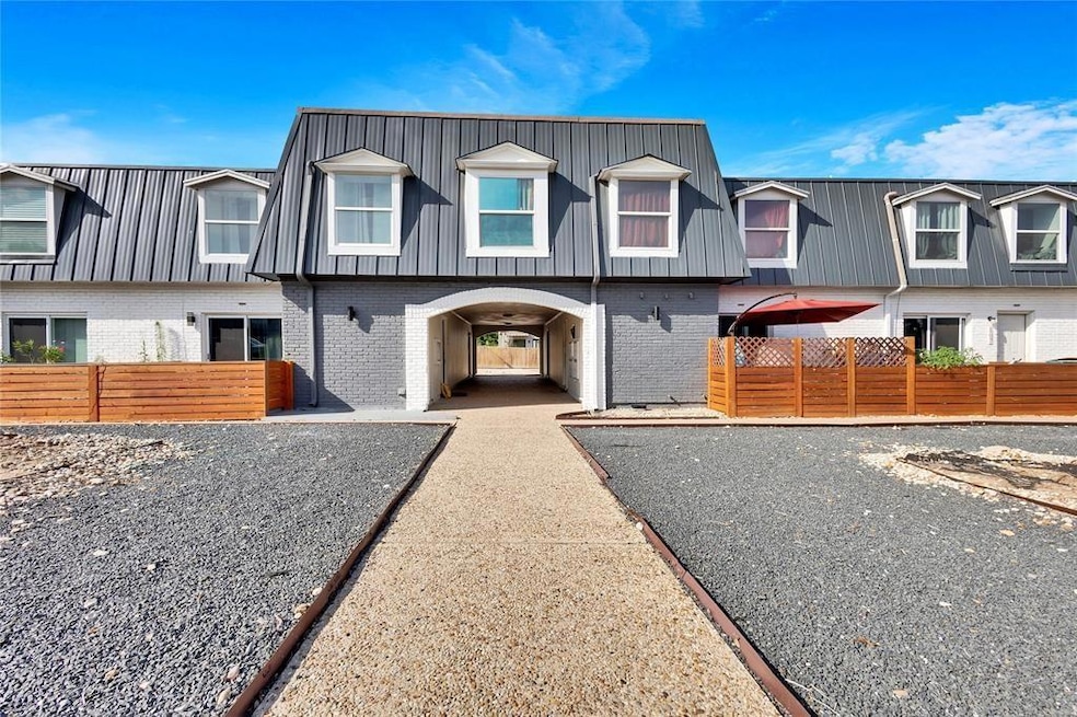 Townhome / multi-family property featuring fence 