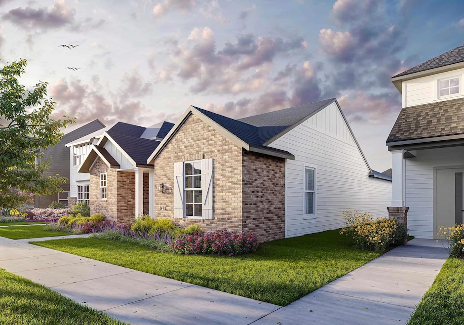 View of front of home featuring brick siding, sola