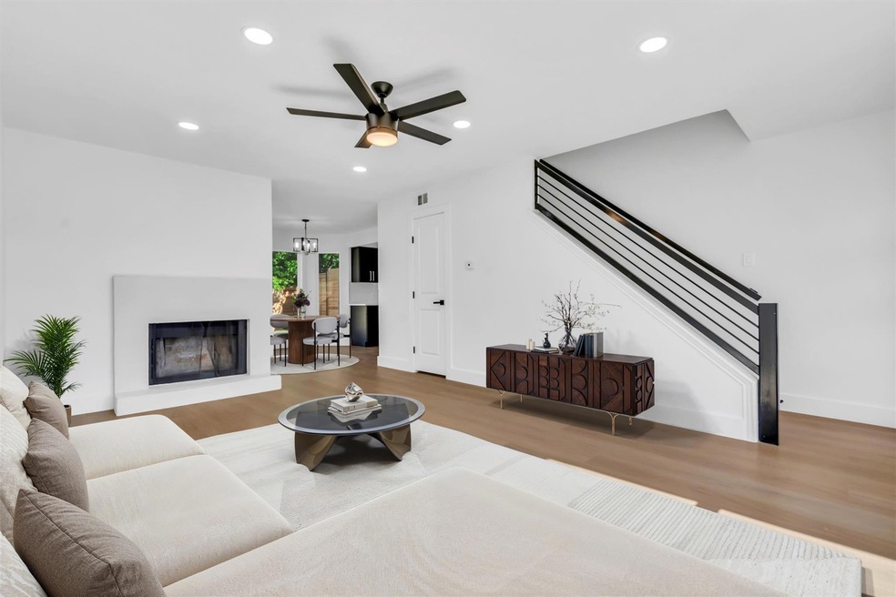 Living room featuring wood finished floors, reces
