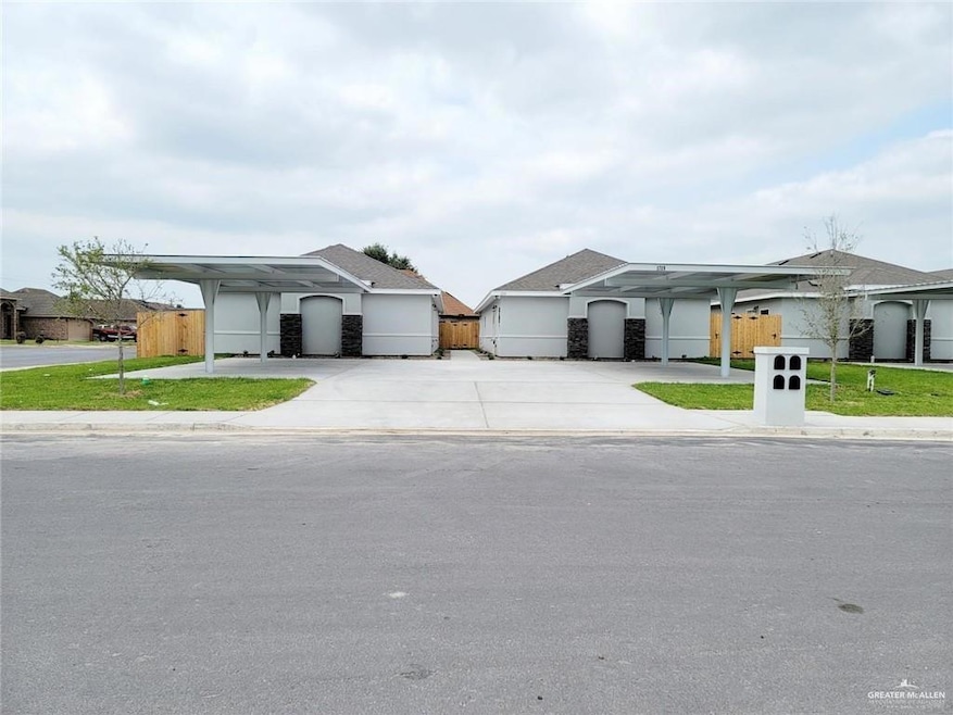 Ranch-style home featuring concrete driveway