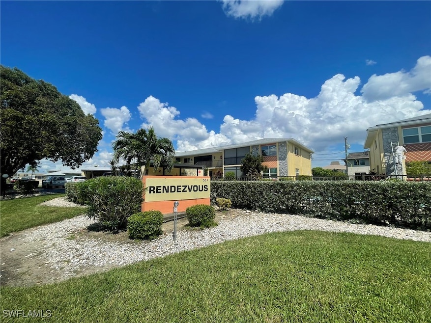 Community sign featuring a lawn