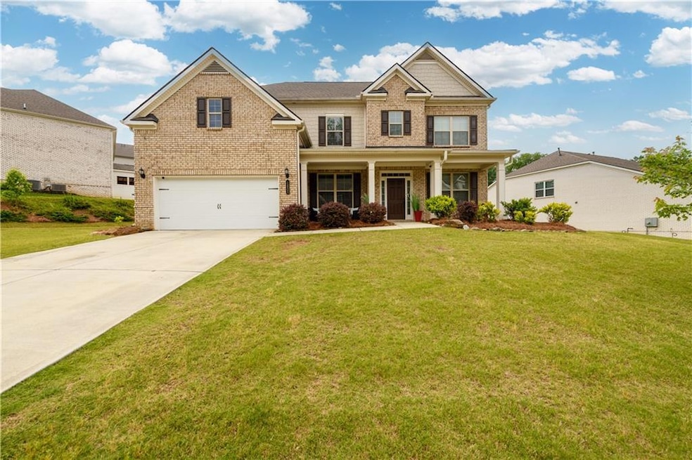 Craftsman house featuring brick siding, driveway, 