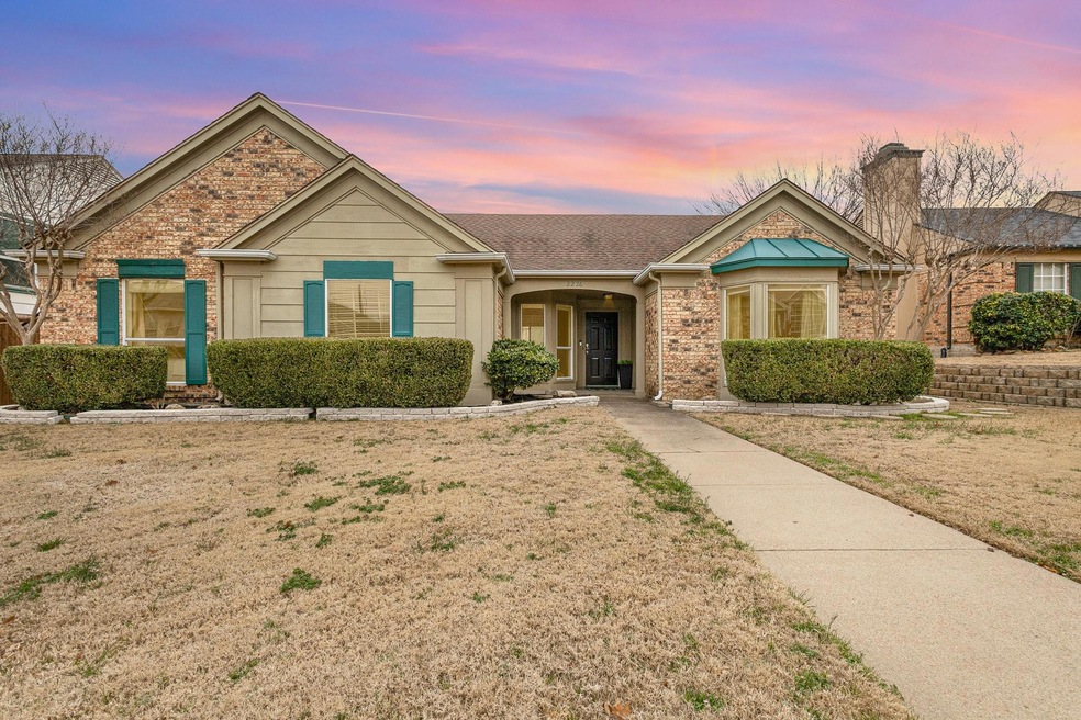 Ranch-style house featuring a yard and brick sidin
