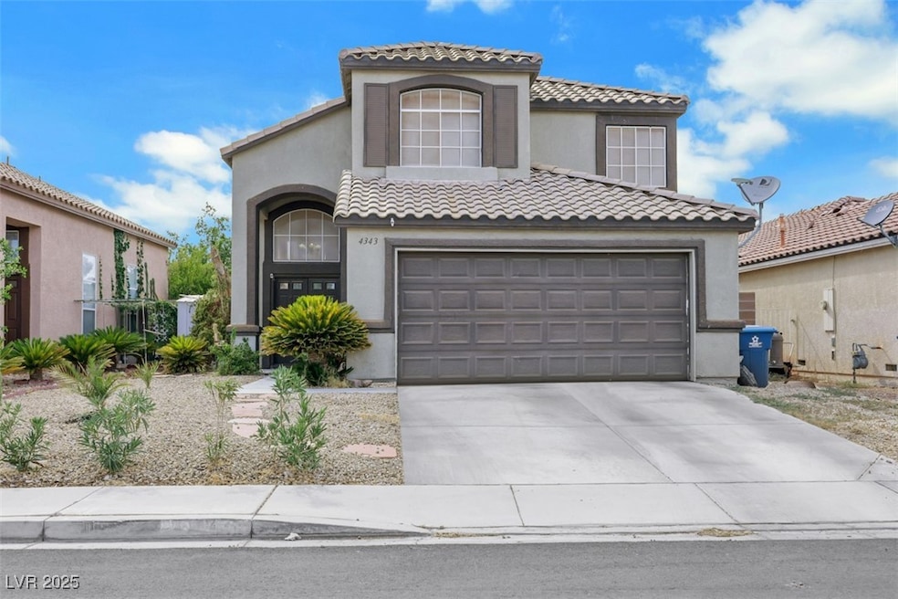 Mediterranean / spanish house featuring concrete driveway, stucco siding, and a tile roof