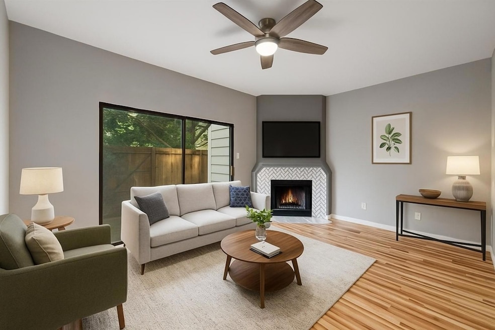 Living area with light wood-style floors, ceiling
