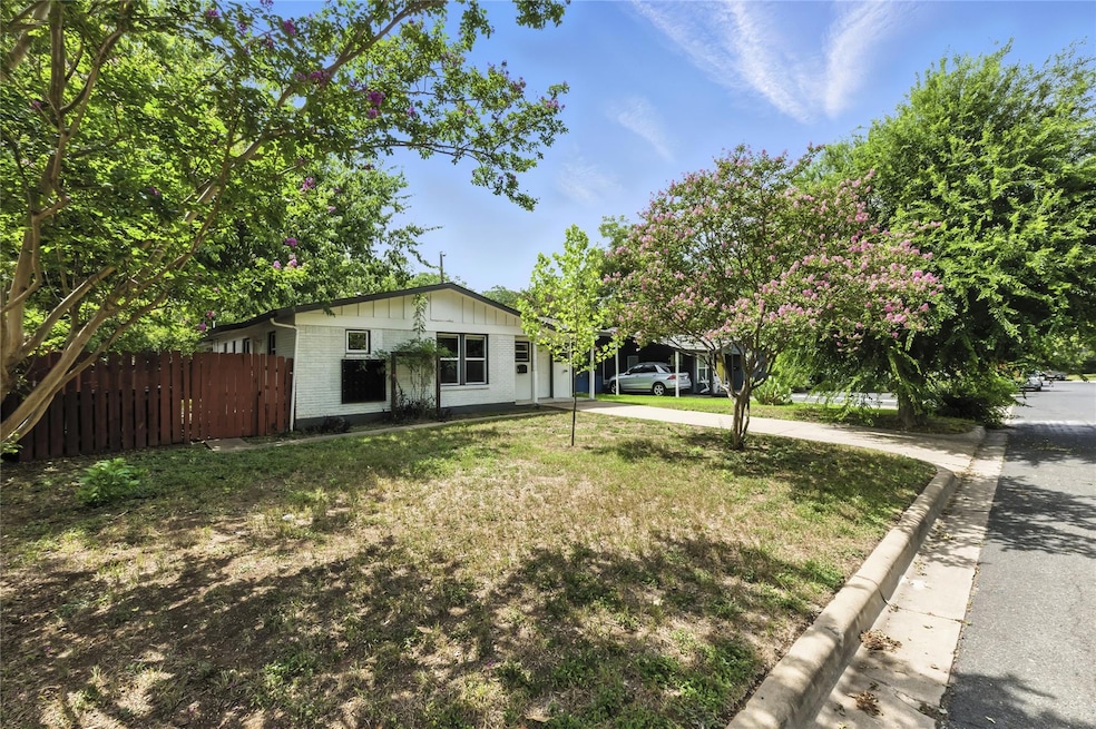 View of front of home featuring brick siding and 