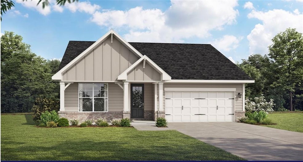 View of front of house with a garage, concrete driveway, a front lawn, and board and batten siding