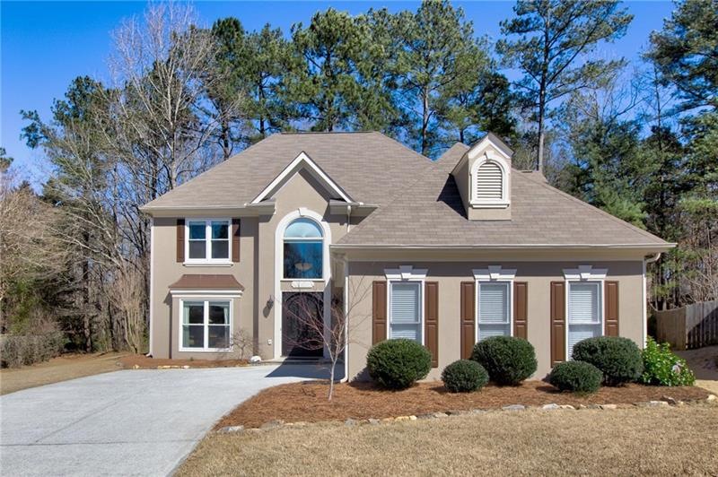 Well kept hardcoat stucco home with side entry gar
