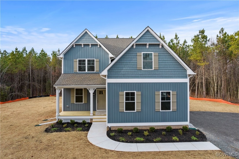 View of front of home featuring roof with shingles