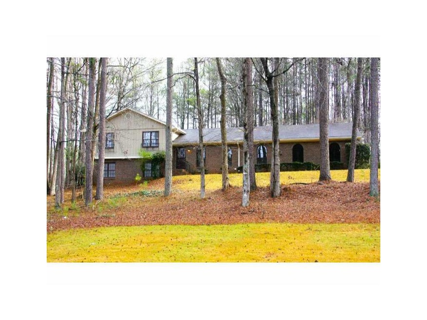 Exterior Front. Home is situated on a gentle rise 
