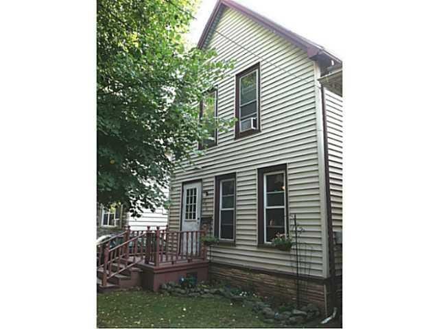 Exterior Front. Vinyl sided and front porch.
