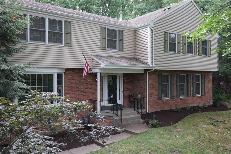 Exterior Front- nestled into quiet secluded mature