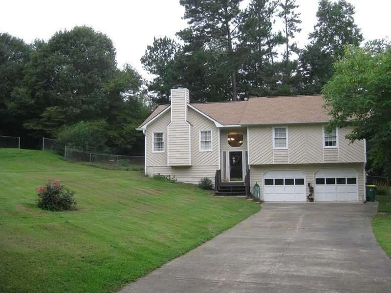 Exterior Front. Large level driveway.