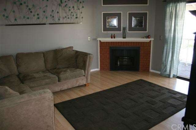 Family Room with Fireplace and access to balcony