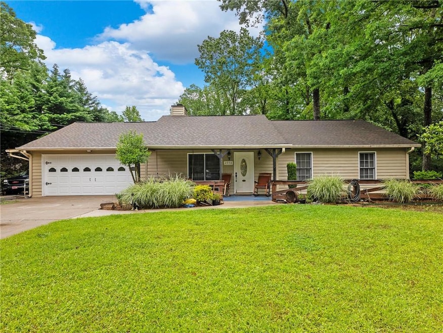 Single story home with a garage, concrete driveway