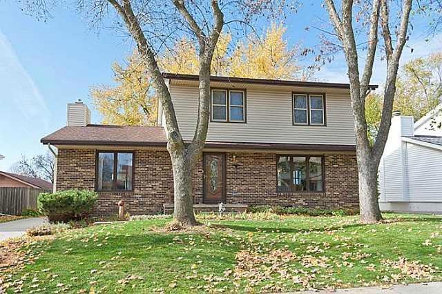 Exterior Front. Brick front, mature trees, perenni