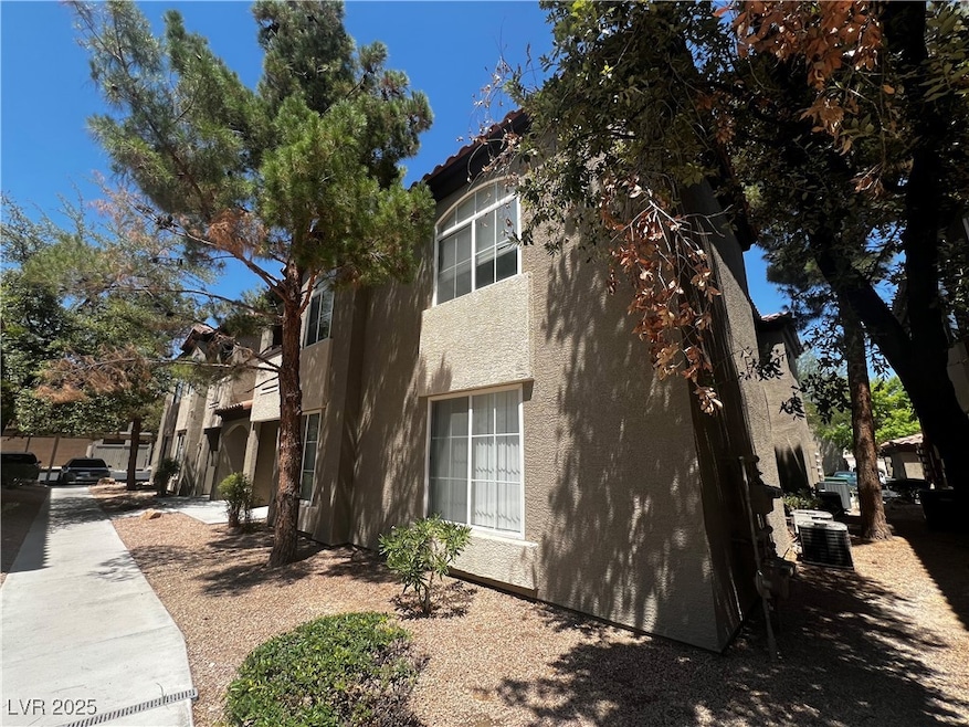 View of side of home featuring stucco siding and a