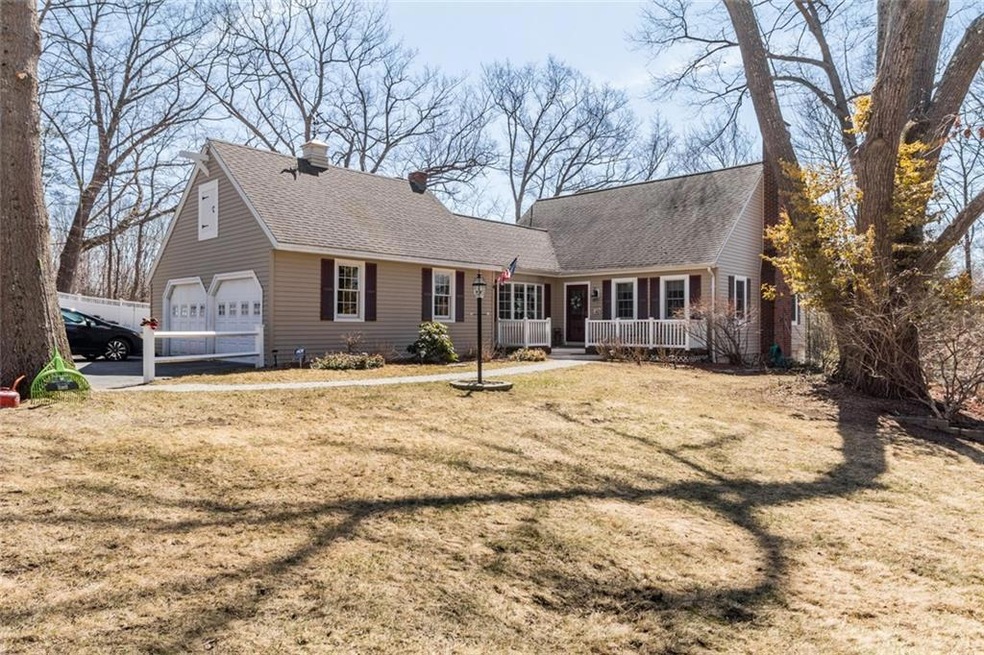 Front of house showing brick chimney...