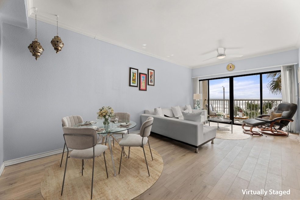 Spacious living dining with floor to ceiling doors