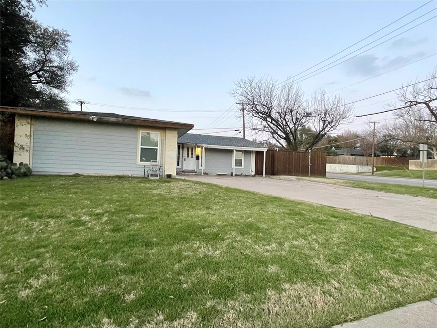 Single story home featuring driveway, fence, and a