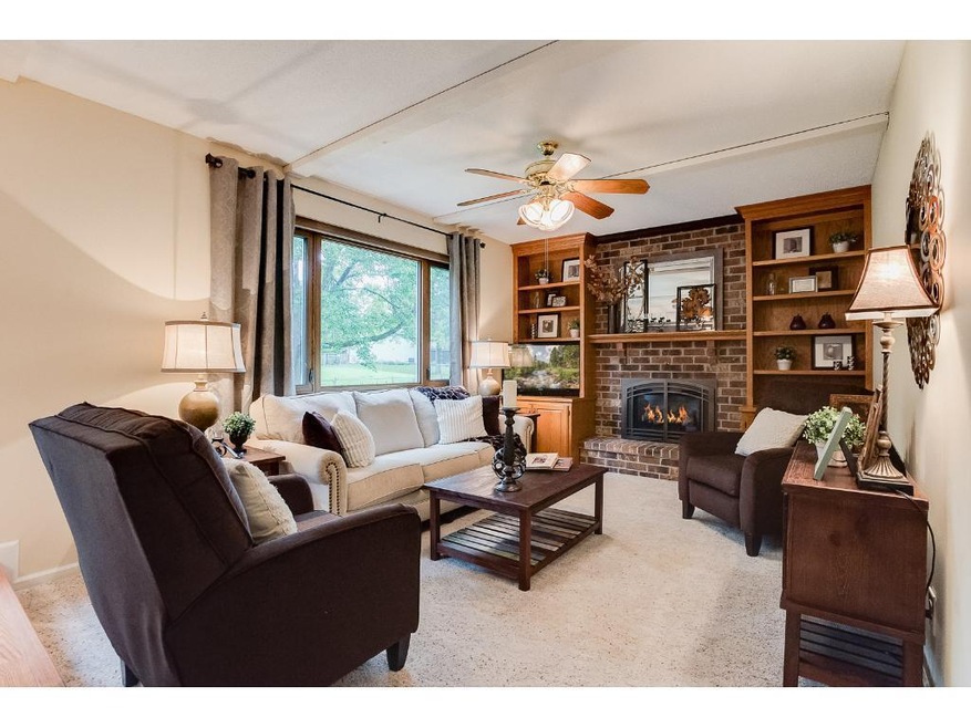 Warm great room atmosphere is created by the gas f