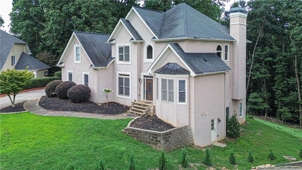 Rear view of house with a yard