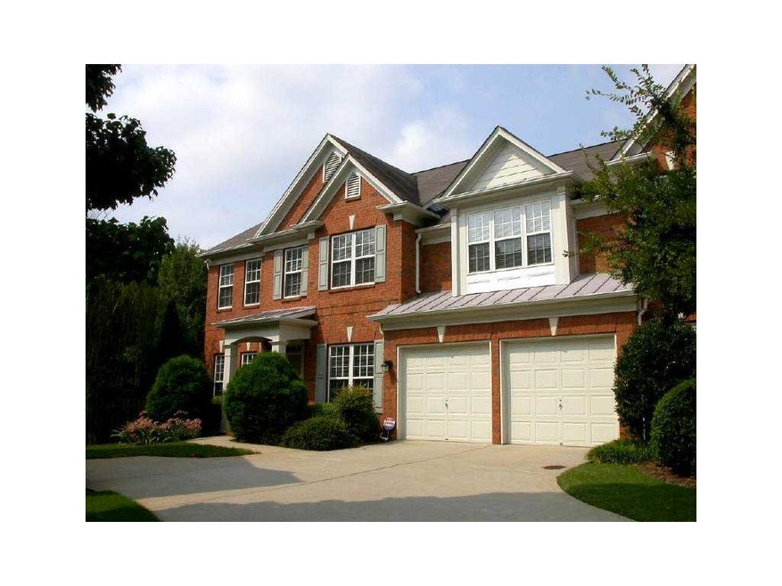 Exterior Front. Stunning 4-sided brick, end unit t