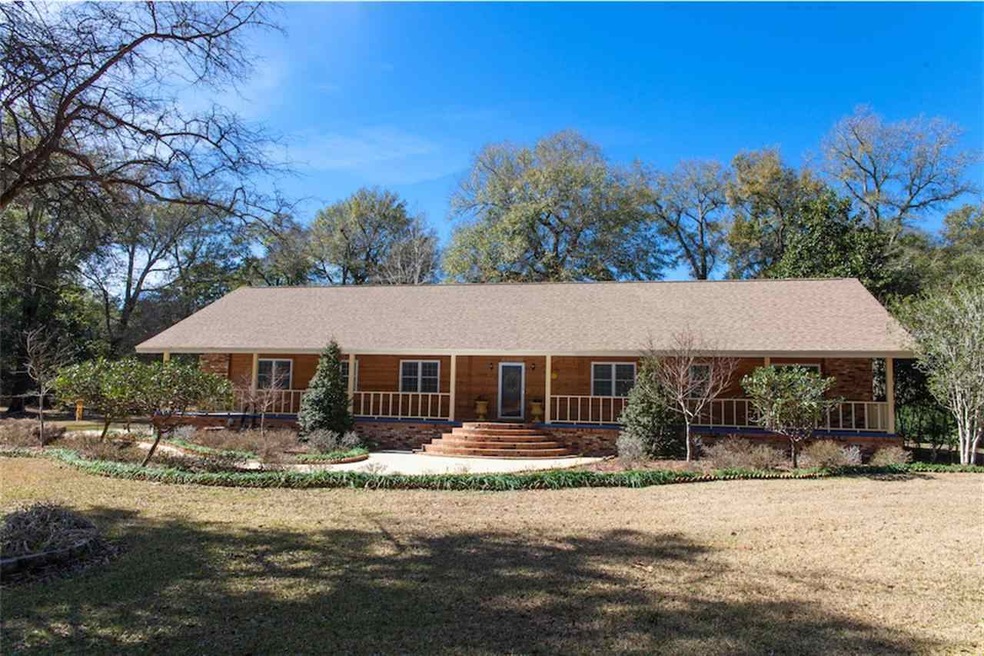 Large home located on 1.73 tree shaded acres.