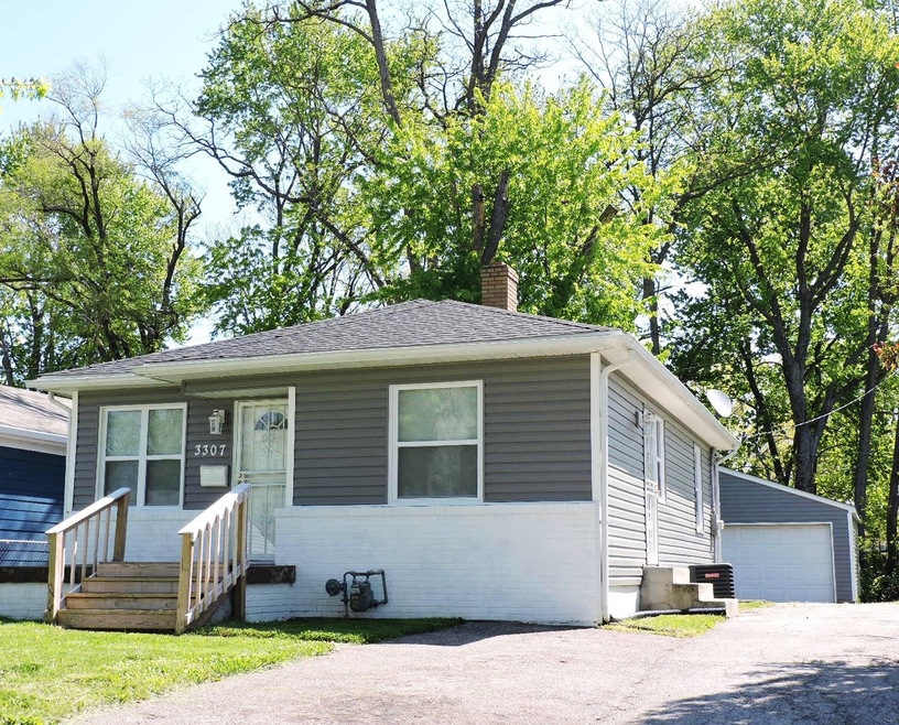 MOVE-IN READY HM WITH 2-CAR DETACHED GARAGE WITH GARAGE DOOR OPENER. UPDATES GALORE: NEW LAMINATE FLOORS, FRESH PAINT, NEW WINDOWS, BATHS, KITCHEN