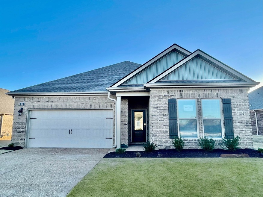 View of front of property featuring a garage and a