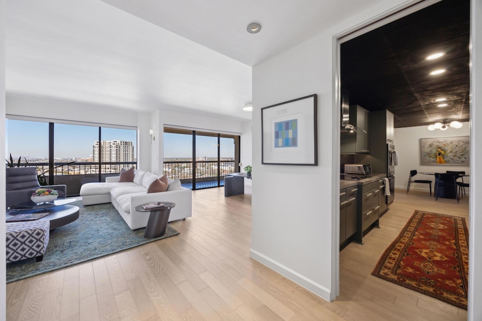 Living room with a view of city, and light wood-st