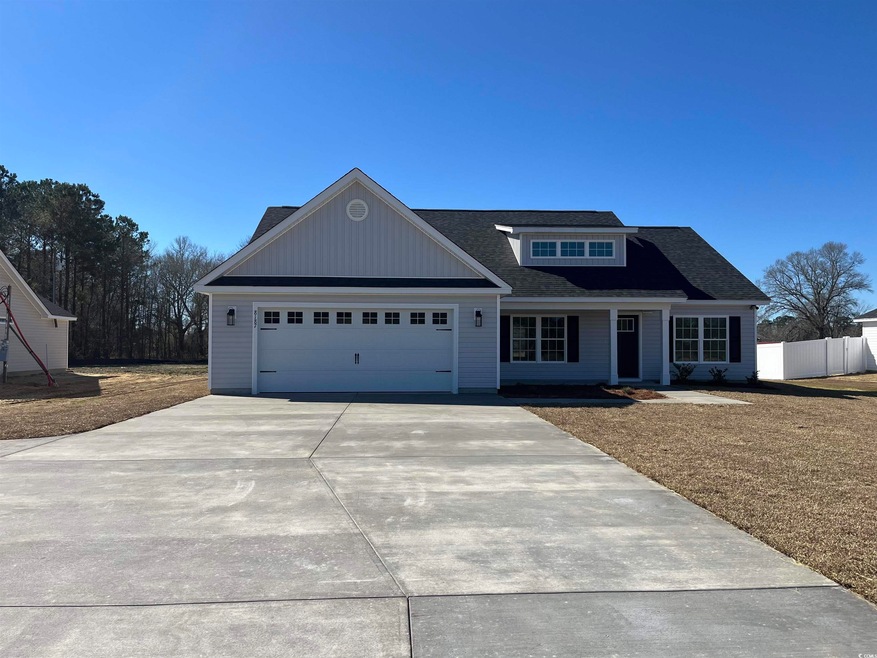 View of front facade featuring a garage