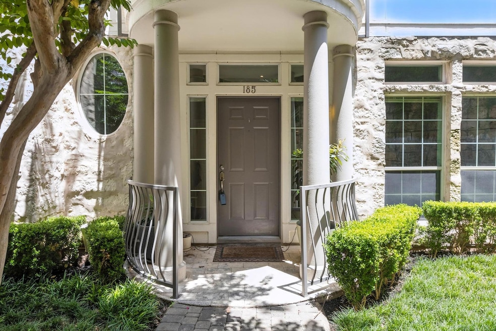 Property entrance featuring stucco siding