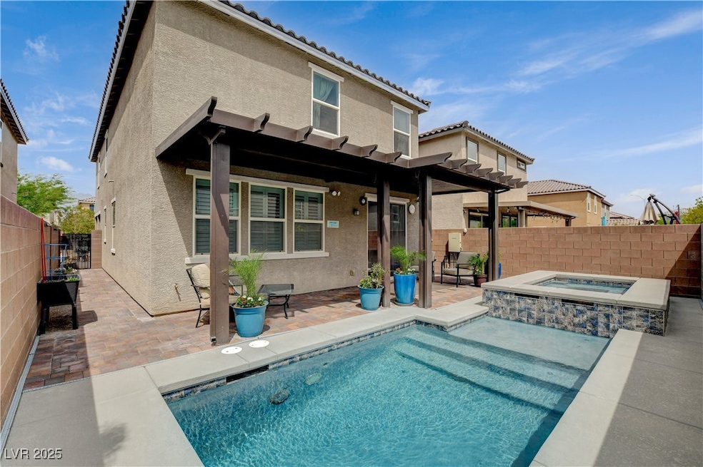 Back of property featuring stucco siding, a patio