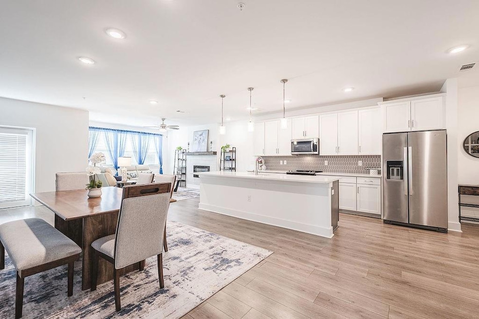 Kitchen with decorative backsplash, light countert