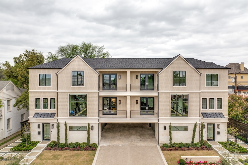 Modern inspired farmhouse with brick siding, concrete driveway, and a shingled roof