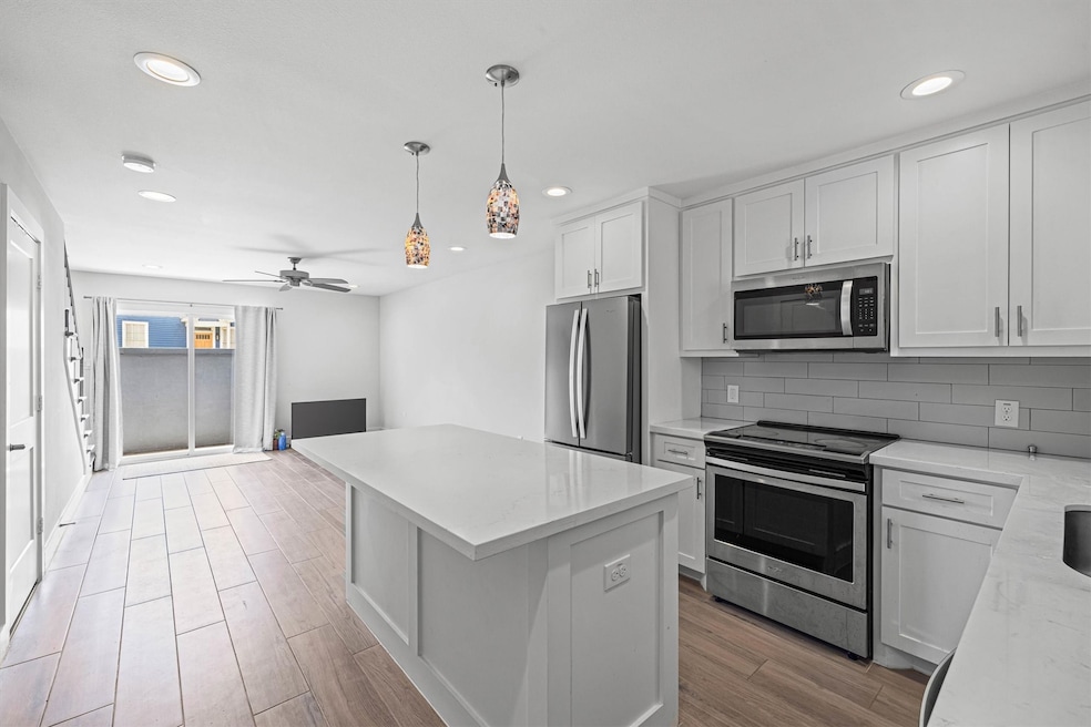 Bright, open-concept kitchen and living space with