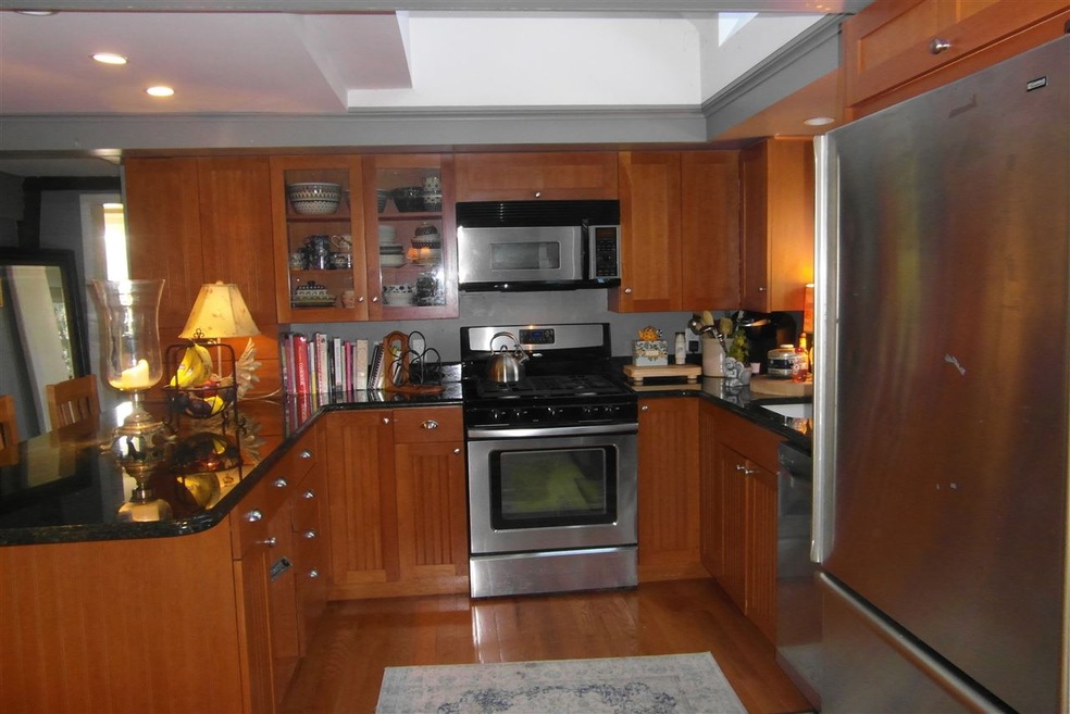 Granite counters, cherry cabinets, with Stainless Steel appliances.