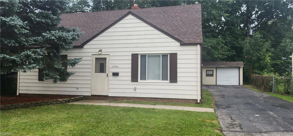 View of front facade featuring garage and a front 